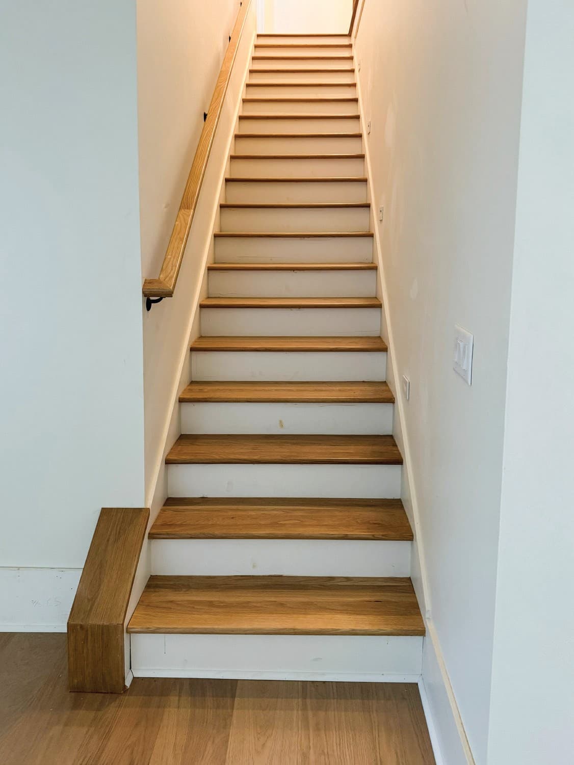 Open concept flooring material transition detail.